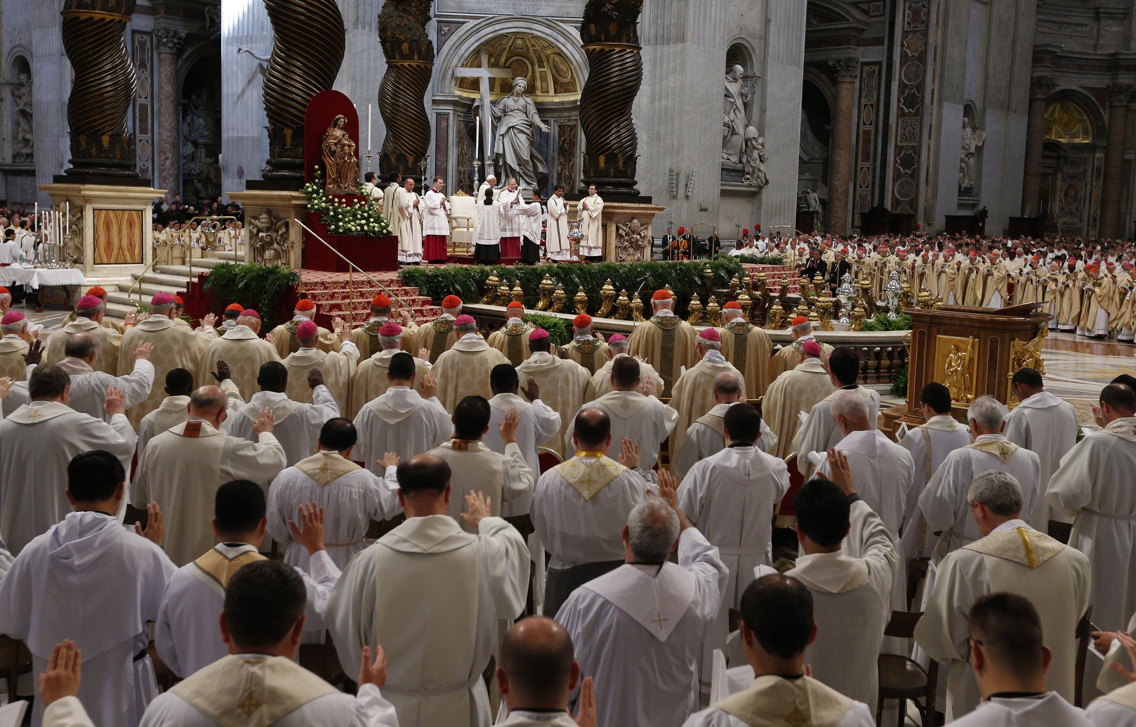 Priests Extend Arms In Prayer As Pope Francis Celebrates Holy Thursday